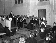 816675 Afbeelding van een promotie in een kerk in Utrecht.